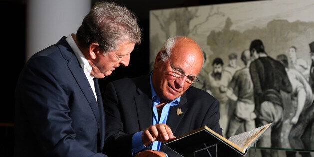 Greg Dyke and Roy Hodgson examine the £2.5m book