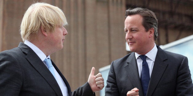 Prime Minister David Cameron chats to Boris Johnson (left), the Mayor of London, at Battersea Power Station in London. Cameron said it was "about time" as he hailed the start of an Â£8 billion redevelopment of Battersea Power Station.