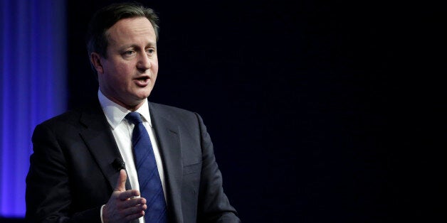 David Cameron, U.K. prime minister, gestures during a session on day three of the World Economic Forum (WEF) in Davos, Switzerland, on Friday, Jan. 24, 2014. World leaders, influential executives, bankers and policy makers attend the 44th annual meeting of the World Economic Forum in Davos, the five day event runs from Jan. 22-25. Photographer: Jason Alden/Bloomberg via Getty Images