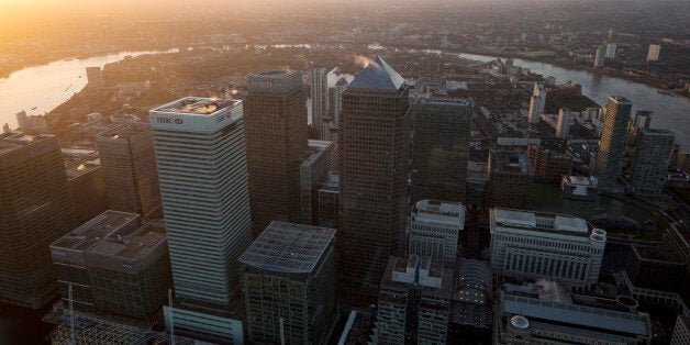 No. 1 Canada Square stands surrounded by the offices of global financial institutions, including HSBC Holdings Plc, Citigroup Inc., JPMorgan Chase & Co., and Barclays Plc, in this aerial photograph looking south across the River Thames towards Greenwich from the Canary Wharf business and shopping district in London, U.K., on Thursday, Dec. 19, 2013. The pound approached a two-year high versus the dollar after Bank of England policy maker Andrew Bailey said the central bank may take steps to prevent U.K. house prices from rising too quickly. Photographer: Matthew Lloyd/Bloomberg via Getty Images