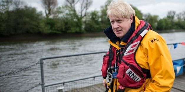 The Mayor of London Boris Johnson meets RNLI Lifeboat crews at Chiswick Lifeboat Station in west London where he also took the wheel of one of their boats on the river Thames during the RNLI's national fund raising week.