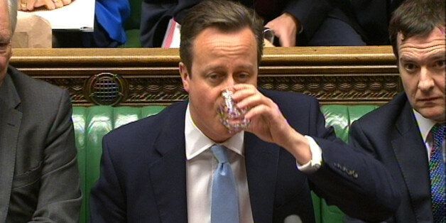 Prime Minister David Cameron takes a sip of water during Prime Minister's Questions in the House of Commons, London.