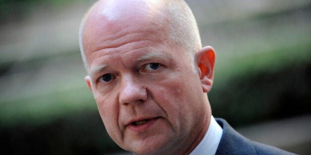 Britain's Foreign Secretary William Hague answers journalists' questions on July 22, 2013 before attending a Foreign Affairs council meeting at the EU Headquarters in Brussels. AFP PHOTO/ JOHN THYS (Photo credit should read JOHN THYS/AFP/Getty Images)