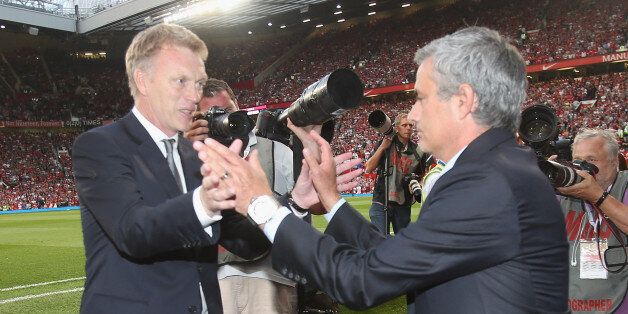 MANCHESTER, ENGLAND - AUGUST 26: Manager David Moyes of Manchester United greets manager Jose Mourinho of Chelsea ahead of the Barclays Premier League match between Manchester United and Chelsea at Old Trafford on August 26, 2013 in Manchester, England. (Photo by John Peters/Man Utd via Getty Images)