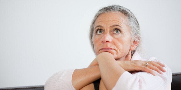 Mature woman looking anxious