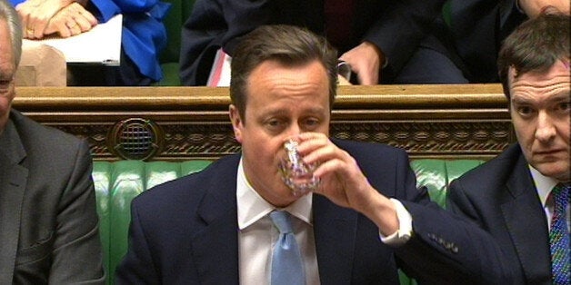 Prime Minister David Cameron takes a sip of water during Prime Minister's Questions in the House of Commons, London.