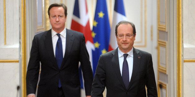 PARIS, FRANCE - MAY 22: British Prime Minister David Cameron and French President Francois Hollande during a press conference at Elysee Palace on May 22, 2013 in Paris, France. The Prime Minister condemned the killing of a man in Woolwich, south London, earlier today, in what police are treating as an act of terrorism. (Photo by Antoine Antoniol/Getty Images)
