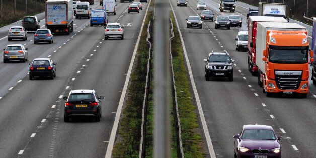 File photo dated 07/01/14 of vehicles on the M1 motorway as car insurance premiums plunged by a record rate of 14.1\% over the last year amid a "more fiercely competitive market" and expectations that more bogus whiplash claims will be weeded out.