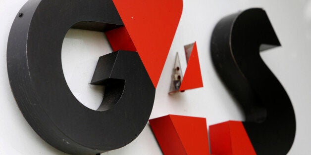 A G4S Plc logo sits on a sign outside the entrance to the company's headquarters in Crawley, U.K., on Friday, July 12, 2013. Chief Executive Officer of G4S Ashley Almanza has asked shareholders about a rights issue, according to a report in Britain's Sunday Times newspaper. Photographer: Chris Ratcliffe/Bloomberg via Getty Images