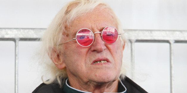 File photo dated 11/10/10 of Jimmy Savile as findings of a series of major investigations by NHS hospitals into allegations of abuse by the disgraced presenter have been published.