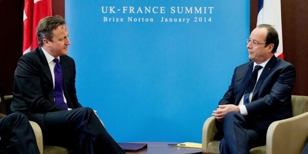 Prime Minister David Cameron (left) attends a meeting with French President Francois Hollande (right) during a one day summit at RAF Brize Norton.