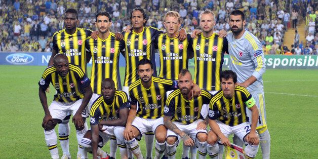 Fenerbahce's players pose during the UEFA Champions League Play Off first leg match between Fenerbahce and Arsenal at Sukru Saracoglu Stadium in Istanbul on August 21, 2013. AFP PHOTO/OZAN KOSE (Photo credit should read OZAN KOSE/AFP/Getty Images)