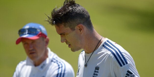 England Ashes Test cricketer Kevin Pietersen (R) speaks with coach Andy Flower (L) during a training session at a suburban cricket ground near Perth on October 29, 2013. Australia will be fighting to win back the Ashes for the first time in six years but injuries, selection woes and a questionable build-up give every sign of a team in upheaval ahead of the first Test against England at the Gabba in Brisbane starting November 21. AFP PHOTO / Greg WOODIMAGE STRICTLY RESTRICTED TO EDITORIAL USE -