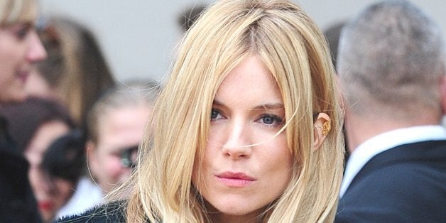 Sienna Miller arriving for the Burberry Prorsum Womenswear show at Kensington Gardens, Kensington Gore, London.