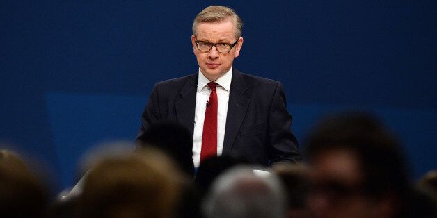 British Secretary of State for Education Michael Gove addresses delegates during the annual Conservative Party Conference in Manchester, northwest England, on October 1, 2013. AFP PHOTO/Paul Ellis (Photo credit should read PAUL ELLIS/AFP/Getty Images)