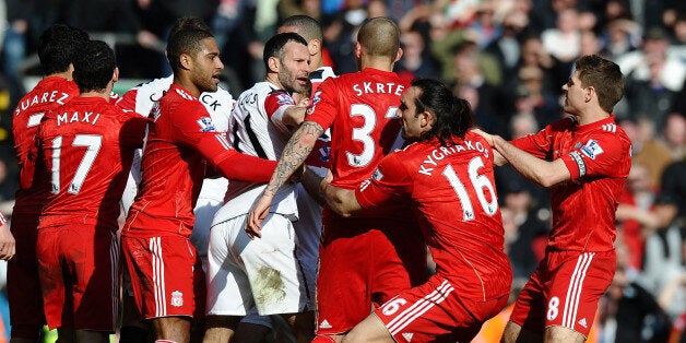 Players from both teams clash after Manchester United's Brazilian defender Rafael Da Silva's foul on Liverpool's Brazilian midfielder Lucas Leiva during the English Premier League football match between Liverpool and Manchester United at Anfield, Liverpool, northwest England, on March 6, 2011.AFP PHOTO/ PAUL ELLIS --- RESTRICTED TO EDITORIAL USE Additional licence required for any commercial/promotional use or use on TV or internet (except identical online version of newspaper) of Premier League