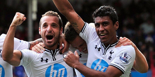 Tottenham Hotspur's Spanish striker Roberto Soldado (2R) celebrates with team mates Brazilian midfielder Paulinho (R), English defender Kyle Walker (2L) and English midfielder Aaron Lennon (L) after scoring a penalty for the opening goal during their English Premier League football match against Tottenham Hotspur at Selhurst Park in London on August 18, 2013. AFP PHOTO/GLYN KIRK == RESTRICTED TO EDITORIAL USE. NO USE WITH UNAUTHORIZED AUDIO, VIDEO, DATA, FIXTURE LISTS, CLUB/LEAGUE LOGOS OR L