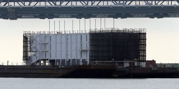 SAN FRANCISCO, CA - OCTOBER 30: A barge under construction is docked at a pier on Treasure Island on October 30, 2013 in San Francisco, California. Mystery barges with construction of shipping containers have appeared in San Francisco and Portland, Maine, prompting online rumors that the barges are affiliated with a Google project. (Photo by Justin Sullivan/Getty Images)