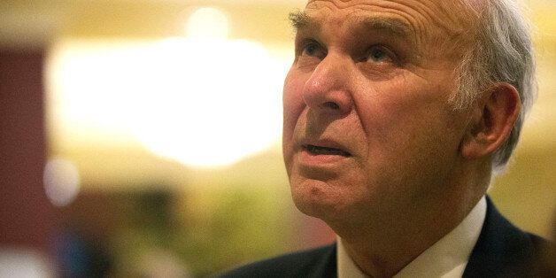 BRIGHTON, ENGLAND - MARCH 08: Business secretary Vince Cable walks through the foyer of the Hilton Metropole during the opening day of the Liberal Democrat spring party conference on March 8, 2013 in Brighton, England. The conference opens in the wake of several scandals within the party, but also after a successful by-election campaign in the constituency of Eastleigh. (Photo by Matthew Lloyd/Getty Images)