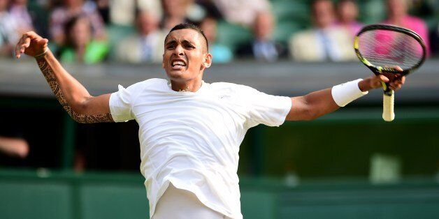 Australia's Nick Kyrgios celebrates winning a game against Spain's Rafael Nadal during their men's singles fourth round match on day eight of the 2014 Wimbledon Championships at The All England Tennis Club in Wimbledon, southwest London, on July 1, 2014. AFP PHOTO / CARL COURT - RESTRICTED TO EDITORIAL USE (Photo credit should read CARL COURT/AFP/Getty Images)