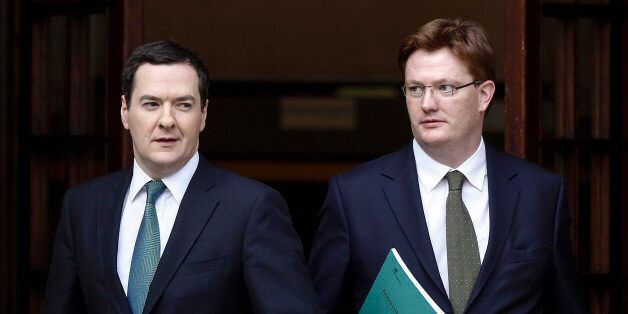 George Osborne, U.K. chancellor of the exchequer, left, and Danny Alexander, U.K. chief secretary to the treasury, leave the HM Treasury building for the Houses of Parliament in London, U.K., on Thursday, Dec. 5, 2013. Osborne will deliver his end-of-year report today against the brightest economic backdrop since the coalition took office more than three years ago. Photographer: Simon Dawson/Bloomberg via Getty Images