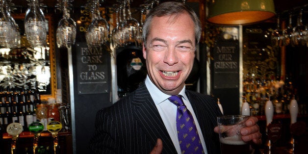 UK Independent Party (UKIP) leader Nigel Farage enjoys a pint of beer in a pub in central London on May 3, 2013. The anti-immigration UK Independence Party (UKIP) was celebrating some of its best ever results following local elections which delivered a bloody nose to Britain's ruling coalition. AFP PHOTO/BEN STANSALL (Photo credit should read BEN STANSALL/AFP/Getty Images)