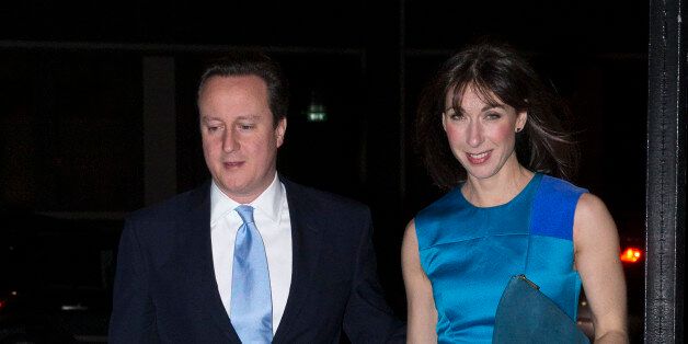 LONDON, ENGLAND - FEBRUARY 05: British Prime Minister David Cameron and his wife Samantha arrive at the Old Billingsgate Market to attend the the annual Conservative Party Black and White Fundraising Ball on February 5, 2014 in London, England. (Photo by Oli Scarff/Getty Images)