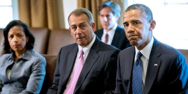 Speaker of the House John Boehner (C), R-OH and National Security Advisor Susan Rice listen as US President Barack Obama delivers a statement on Syria during a meeting with members of Congress at the White House in Washington, DC, September 3, 2013. Obama told congressional leaders that Syrian President Bashar al-Assad needs to be held accountable for allegedly carrying out the August 21 attack near Damascus, which US officials say killed nearly 1,500 people, including hundreds of children. AFP PHOTO/Jim WATSON (Photo credit should read JIM WATSON/AFP/Getty Images)