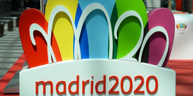 The logo for the city of Madrid's candidature for the 2020 Summer Olympic Games is pictured at the entrance of an exhibition on August 29, 2013 in Madrid. Madrid is bidding against Istanbul and Tokyo to host the 2020 Olympic and Paralympic Summer Games. The International Olympic Committee (IOC) will reveal the host city at the 125th IOC Session in Buenos Aires next September 7. AFP PHOTO / GERARD JULIEN (Photo credit should read GERARD JULIEN/AFP/Getty Images)