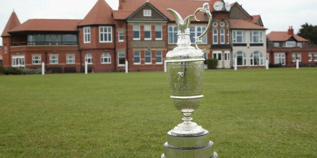 HOYLAKE, ENGLAND - APRIL 23: The Open Championship trophy (also known as the claret jug) is pictured in front of the clubhouse during The Open Championship Media Day at Royal Liverpool Golf Club on April 23, 2014 in Hoylake, England. (Photo by Andrew Redington/Getty Images)