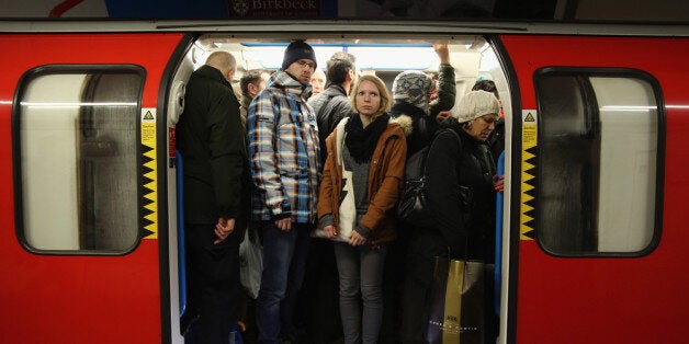 LONDON, ENGLAND - FEBRUARY 05: Commuters crowd on to a tube at Oxford Street station on February 5, 2014, in London, England. Today marks the first full day of a 48 hour strike by London underground workers. Workers on London's Underground train system began strike action at 9:00 pm on Tuesday February 4, causing chaos for commuters arriving for work this morning. (Photo by Dan Kitwood/Getty Images)