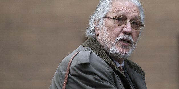 LONDON, ENGLAND - FEBRUARY 05: Radio presenter Dave Lee Travis arrives at Southwark Crown Court on February 5, 2014 in London, England. Dave Lee Travis, whose real name is David Patrick Griffin, is charged with 14 counts of indecent assaults and one of sexual assault, which allegedly took place between 1977 and 2007 against victims aged between 15 and 29. Dave Lee Travis entered a not guilty plea to the charges in October last year. (Photo by Oli Scarff/Getty Images)