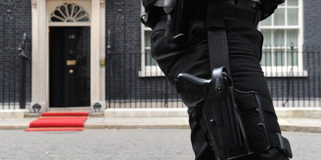An armed Police officer outside10 Downing Street, London.