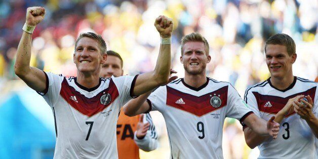 (L/R): Germany's midfielder Bastian Schweinsteiger, Germany's forward Andre Schuerrle and Germany's defender Matthias Ginter react after victory in the quarter-final football match between France and Germany at The Maracana Stadium in Rio de Janeiro on July 4, 2014,during the 2014 FIFA World Cup. AFP PHOTO / PATRIK STOLLARZ (Photo credit should read PATRIK STOLLARZ/AFP/Getty Images)