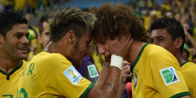 Brazil's forward Neymar (L) celebrates with Brazil's defender David Luiz during the quarter-final football match between Brazil and Colombia at the Castelao Stadium in Fortaleza during the 2014 FIFA World Cup on July 4, 2014. AFP PHOTO / VANDERLEI ALMEIDA (Photo credit should read VANDERLEI ALMEIDA/AFP/Getty Images)