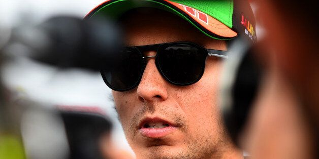 NORTHAMPTON, ENGLAND - JULY 03: Sergio Perez of Mexico and Force India speaks to members of the media during previews ahead of the British Formula One Grand Prix at Silverstone Circuit on July 3, 2014 in Northampton, United Kingdom. (Photo by Christopher Lee/Getty Images)