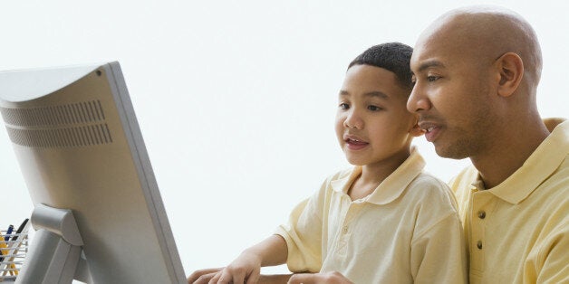 Stock image of man helping young boy