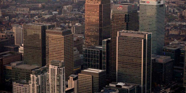 No. 1 Canada Square stands surrounded by the offices of global financial institutions, including HSBC Holdings Plc, Citigroup Inc., and JPMorgan Chase & Co., in this aerial photograph looking north towards Tower Hamlets from Canary Wharf business and shopping district in London, U.K., on Monday, Dec. 9, 2013. Bank of England Governor Mark Carney said Britain's recovery will need to be sustained for a while before it is strong enough to withstand higher interest rates. Photographer: Matthew Lloyd