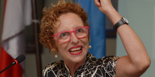 Raquel Rolnik, an independent expert charged by the United Nation Human Right Council to monitor and report on adequate housing worldwide, gestures during a press conference in Jakarta on June 11, 2013. Rolnik, who examined several housing policies and programmes in the country, including some targeting low-income households, said on June 11 that Indonesia faced huge challeges in promoting and protecting the right to adequate housing. AFP PHOTO / ADEK BERRY (Photo credit should read ADEK