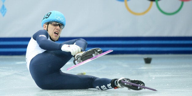 Great Britain's Jack Whelbourne falls as he competes in the Men's Short Track 1500 m Final at the Iceberg Skating Palace during the Sochi Winter Olympics on February 10, 2014. AFP PHOTO / JUNG YEON-JE (Photo credit should read JUNG YEON-JE/AFP/Getty Images)