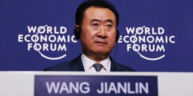 Billionaire Wang Jianlin, chairman and president of Dalian Wanda Group, listens during a news conference at the World Economic Forum Annual Meeting Of The New Champions in Dalian, China, on Wednesday, Sept. 11, 2013. Wang, China's richest man and owner of the country's biggest commercial land developer, said he has hired two investment banks to buy hotel management companies, mostly in the U.S. Photographer: Tomohiro Ohsumi/Bloomberg via Getty Images