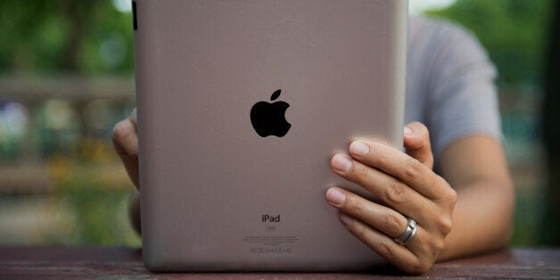 An Apple Inc. iPad is displayed for a photograph in the Brooklyn borough of New York, U.S., on Tuesday, Aug. 27, 2013. Apple Inc. plans to roll out an iPhone trade-in program in certain stores Aug. 30 and more broadly in September, according to 9to5Mac. Photographer: Craig Warga/Bloomberg via Getty Images