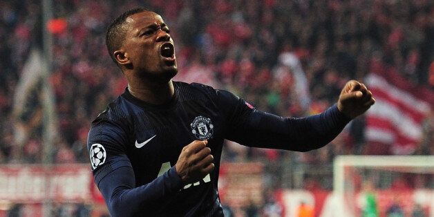 MUNICH, GERMANY - APRIL 09: Patrice Evra of Manchester United celebrates his goal during the UEFA Champions League Quarter Final second leg match between FC Bayern Muenchen and Manchester United at Allianz Arena on April 9, 2014 in Munich, Germany. (Photo by Shaun Botterill/Getty Images)