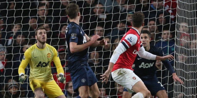 LONDON, ENGLAND - FEBRUARY 12: David de Gea of Manchester United in action during the Barclays Premier League match between Arsenal and Manchester United at Emirates Stadium on February 12, 2014 in London, England. (Photo by John Peters/Man Utd via Getty Images)