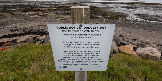 A sign next to Dalgety Bay beach in Fife as former prime minister Gordon Brown has called on the Ministry of Defence to fund the clean-up of the beach polluted by radiation after a report by an environmental agency named the Government department as responsible.