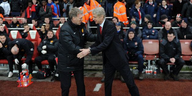 LONDON, ENGLAND - FEBRUARY 12: Arsenal Manager Arsene Wenger shakes hands with Manchester United Manager David moyes before the match between Arsenal and Manchester United in the Barclays Premier League at Emirates Stadium on February 12, 2014 in London, England. (Photo by David Price/Arsenal FC via Getty Images)