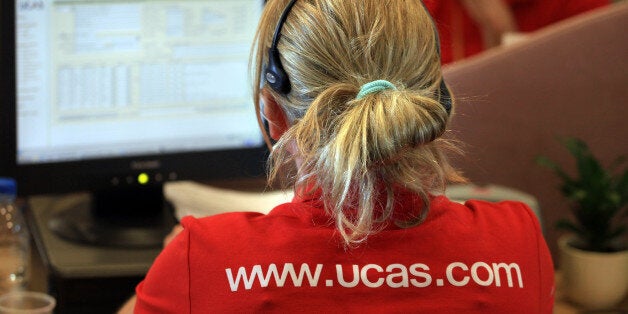 CHELTENHAM, ENGLAND - AUGUST 19: An employee in the Ucas clearing house call centre answers enquiries as she prepares to assist A-level students ahead of results day on August 19, 2009 in Cheltenham, England. With A-level results being published tomorrow, the university admissions service Ucas, say they are expecting 'intense' pressure this year during the clearing process, which matches students who have been turned down by their original choices, to other courses. More than 600,000 people acr