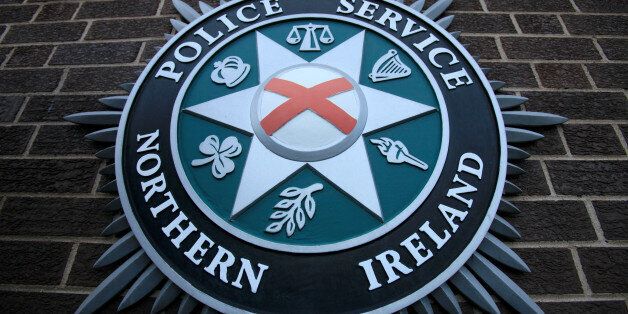 A coat of arms is pictured at the Police Service of Northern Ireland (PSNI) Headquarters in Belfast, Northern Ireland, on February 5, 2010. Northern Ireland's leaders announced a hard-fought accord to transfer key remaining powers from London to Belfast on Friday, hailed as opening a 'new chapter' in the long-troubled province. Responsibility for police and justice in Northern Ireland will transfer to Belfast from April 12, they said, flanked by British Prime Minister Gordon Brown and his Irish