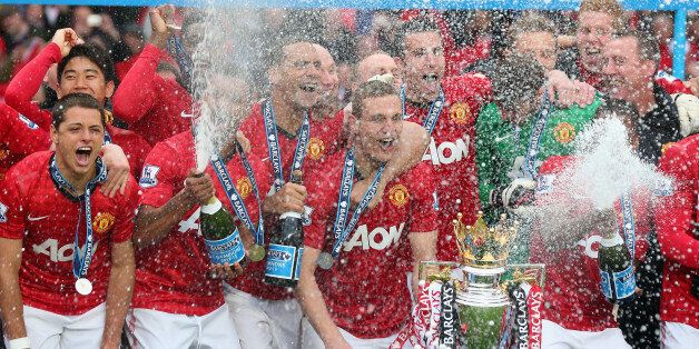 MANCHESTER, ENGLAND - MAY 12: The Manchester United players celebrate with the Premier League trophy following the Barclays Premier League match between Manchester United and Swansea City at Old Trafford on May 12, 2013 in Manchester, England. (Photo by Alex Livesey/Getty Images)