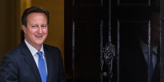 LONDON, ENGLAND - JUNE 23: British Prime Minster David Cameron leaves 10 Downing Street to greet President of the European Council Herman Van Rompuy on June 23, 2014 in London, England. The Prime Minister is meeting with the Council President Herman van Rompuy in London to press his case against the appointment of Jean-Claude Juncker as head the European Commission. (Photo by Rob Stothard/Getty Images)